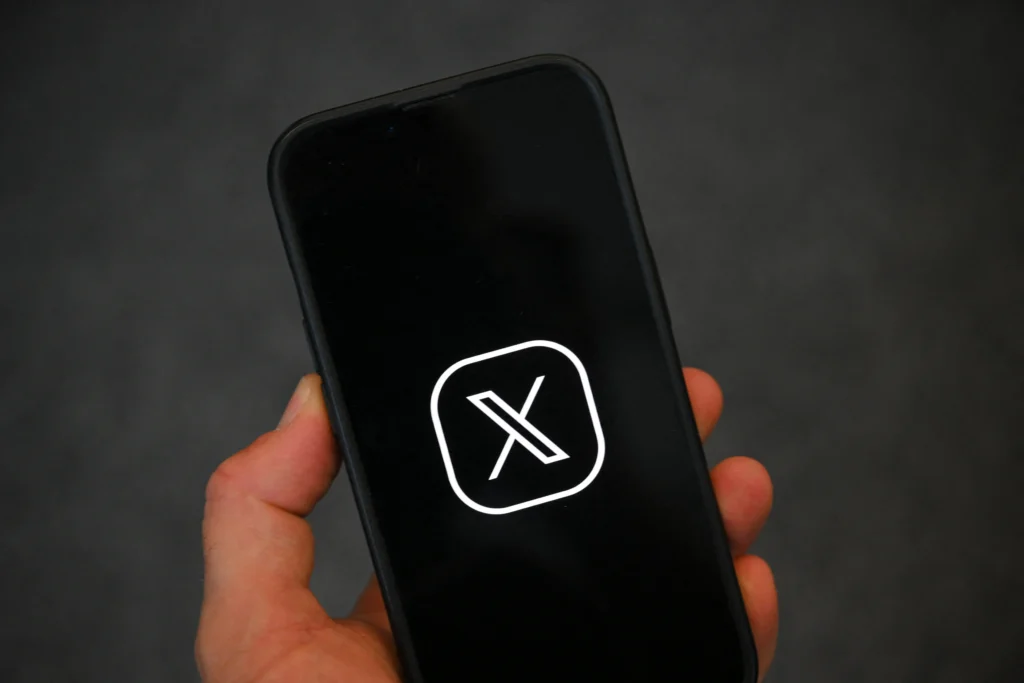 x logo on phone
